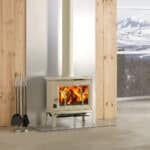 Jotul F100 ECO 2 Wood Burning Stove With Long Legs and Plain Door In Ivory Enamel installed